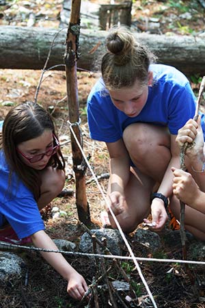 Learning how to build a campfire.